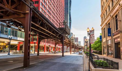 Chicago, USA - May 30, 2016: Downtown street with CTA train metro rail line​